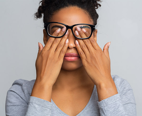 Woman scratching her eyes