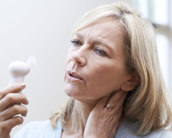 woman holding minifan